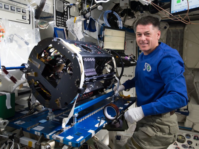 NASA astronaut Shane Kimbrough completing the Multi-user Droplet Combustion Apparatus reconfiguration to the cool flames investigation setup.
