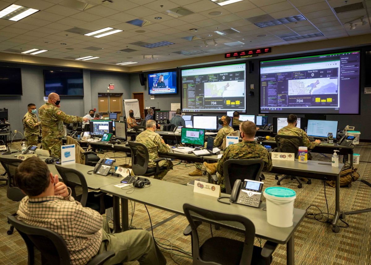 210203-N-PC620-0029 JOINT BASE LANGLEY-EUSTIS, Va. (Feb. 3, 2021) Army Col. Christopher Caldwell, the J3 operations director assigned to Joint Task Force Civil Support (JTF-CS), details the capabilities of the JTF-CS common operating picture to Commanding General Maj. Gen. Jeff Van and JTF-CS staff during a Joint All-Domain Command & Control System demonstration. Joint All-Domain Command & Control System, also known as JADC2, proactively provides support capabilities exactly where JTF-CS may need it during Defense Support of Civil Authorities operations by synergizing multiple data feeds through real-time end-user reporting and collaborative planning. (U.S. Navy photo by Mass Communication Specialist 2nd Class Michael H. Lehman/Released)